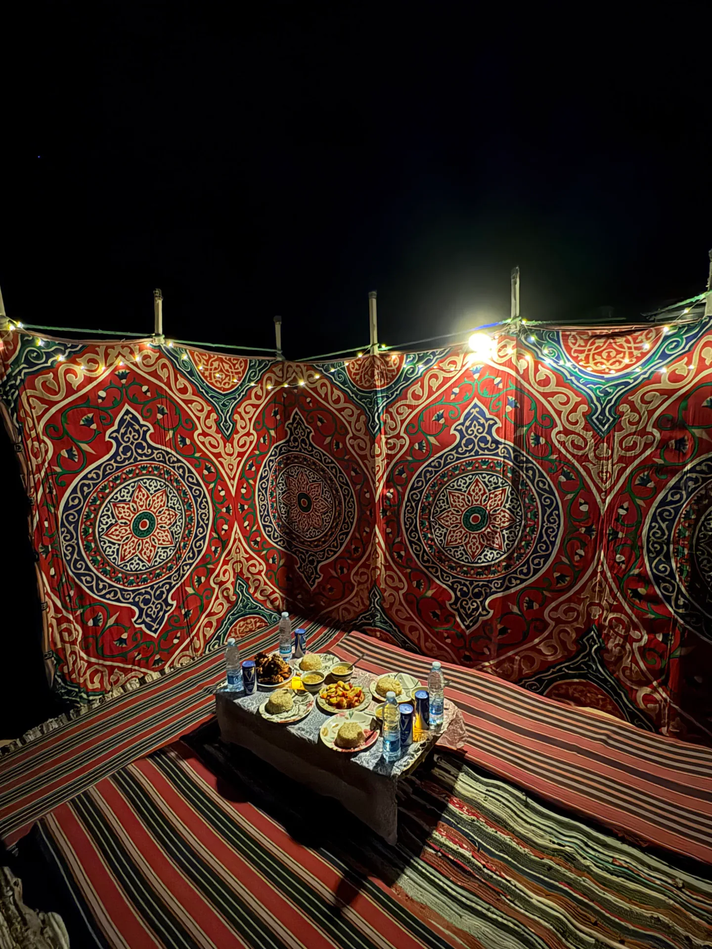 Traditional Bedouin dinner prepared inside a Bahariya desert camp tent