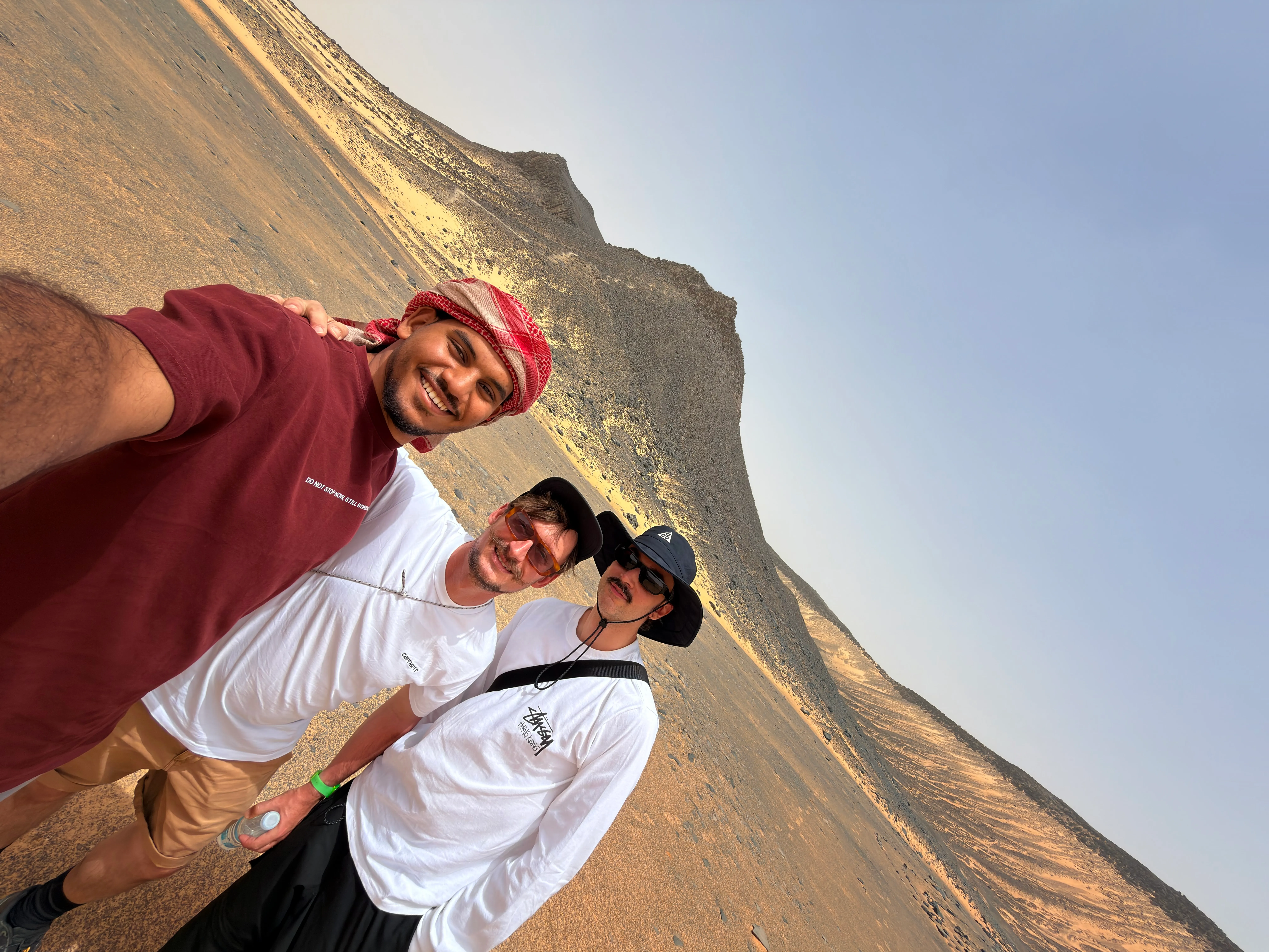 Eyad Elzaghandi with international travelers in the Black Desert