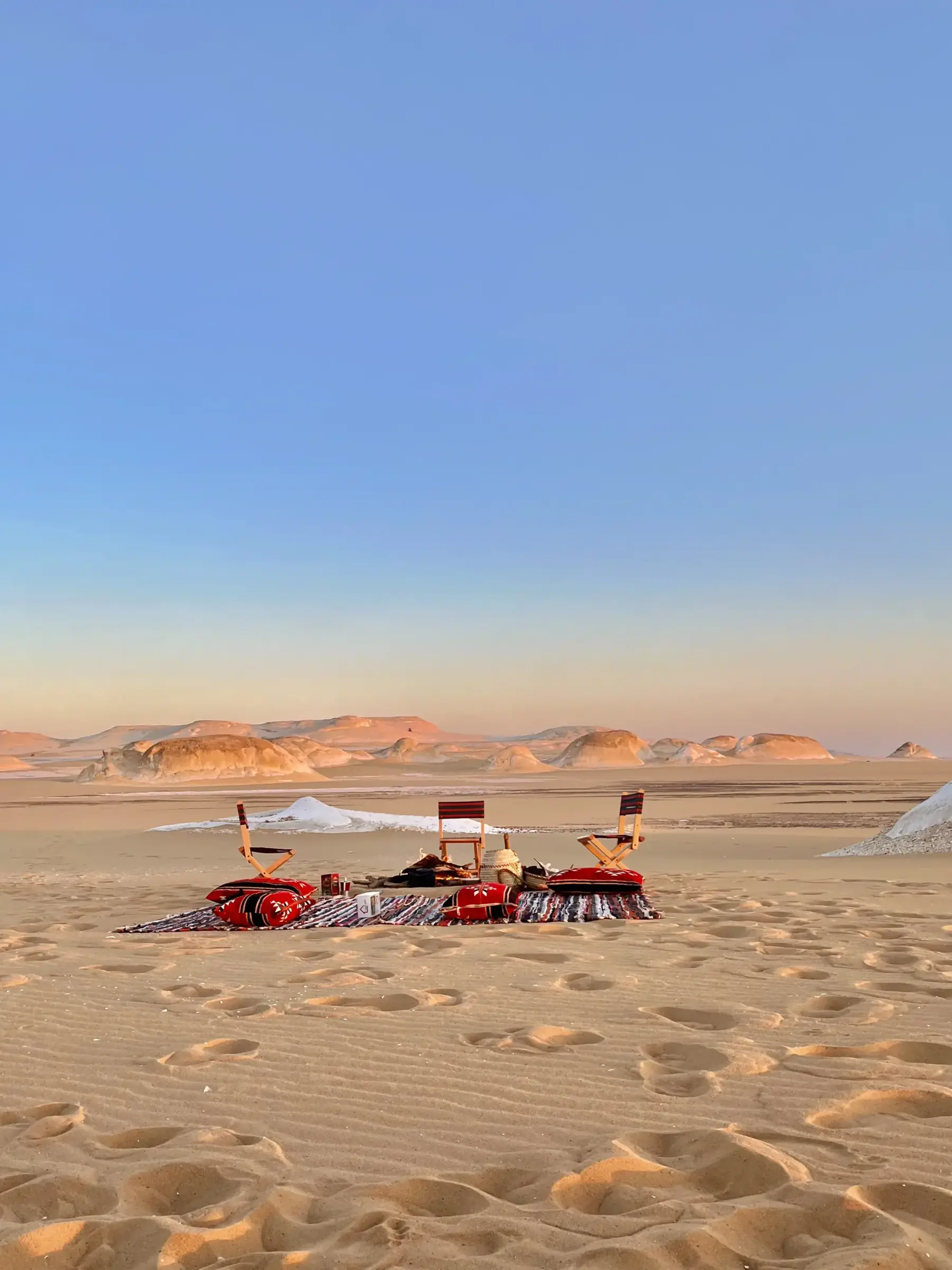 Open desert seating area at sunset in Egypt's White Desert for the 2027 total solar eclipse experience