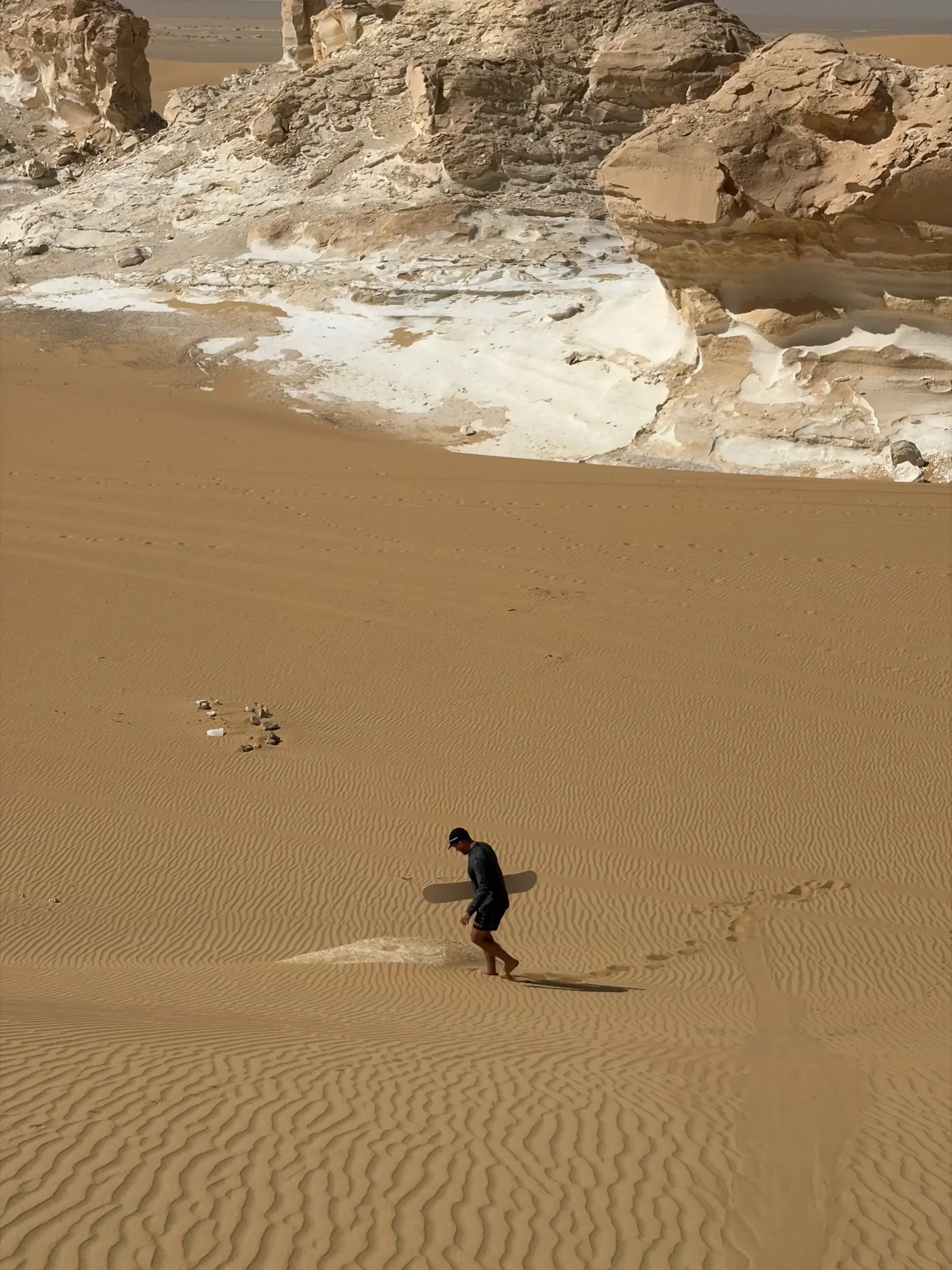 Sandboarding on the White Desert dunes during the four day total solar eclipse tour 2027